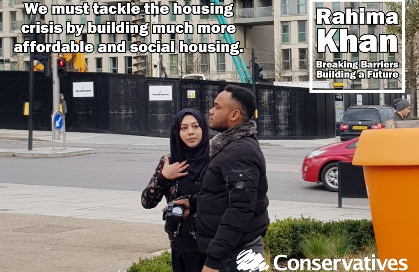 Rahima Khan and a supporter inspecting new homes