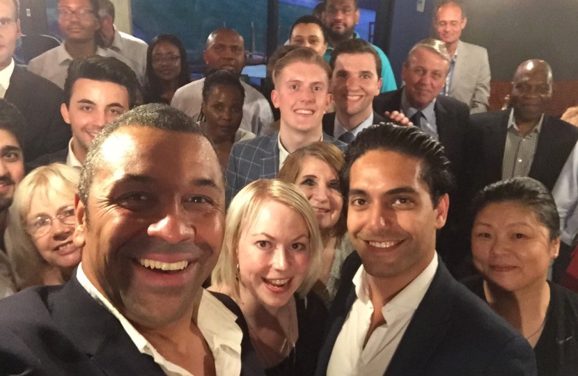 A close up of James Cleverly and dinner attendees.