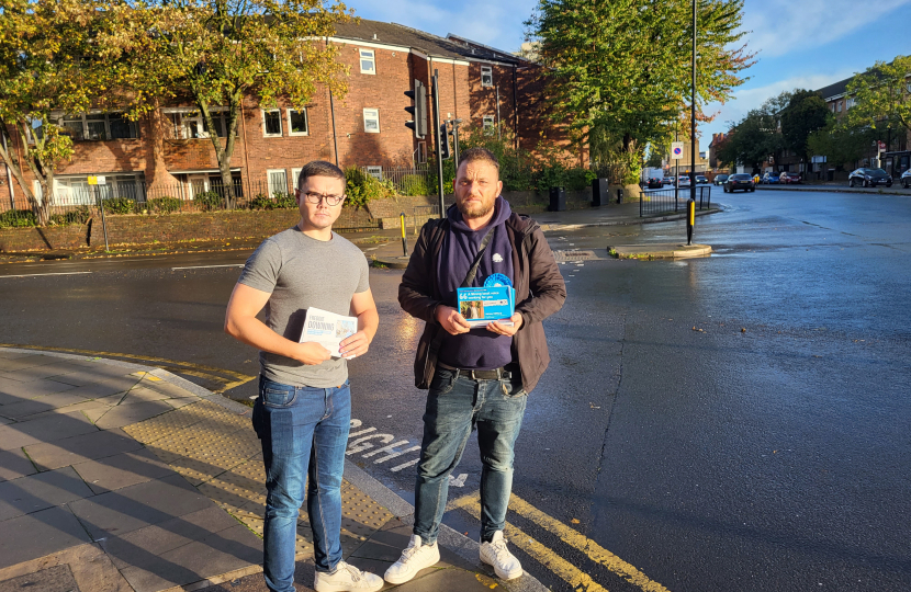 Freddie Downing and James Clifford standing at the junction of Plaistow High Street and Clegg Street