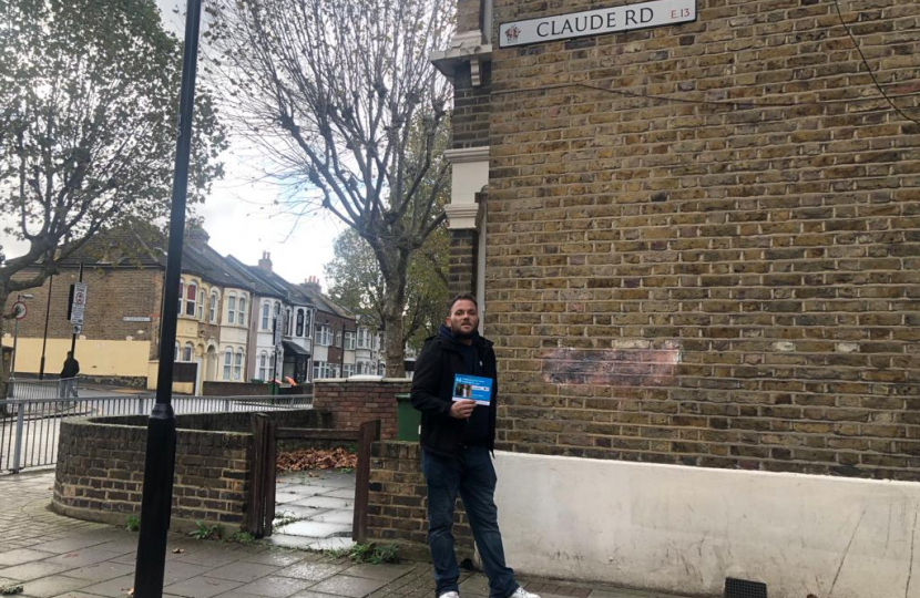  James Clifford standing by the sign for Claude Road