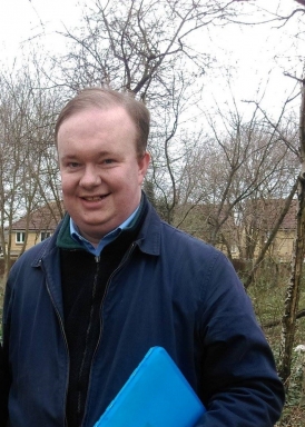 Tim Roll-Pickering with a clipboard